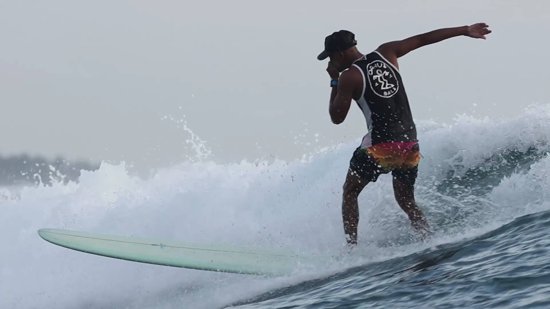 Agus with a smiling surf student after a session in Medewi